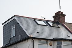 the roof of a house with two windows