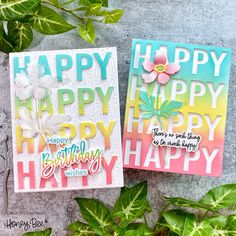 two cards with the words happy, happy and happy written on them next to some leaves