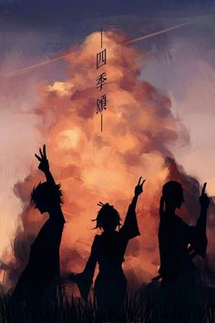 the silhouettes of two people standing in front of an orange cloud with chinese characters on it