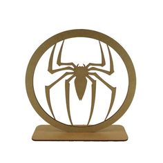 a metal sculpture of a spider - man in the center of a circular frame on a white background