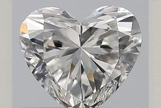 a heart shaped diamond is shown against a gray background