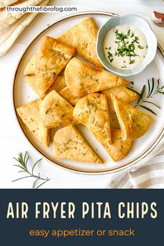 air fryer pita chips on a plate with dipping sauce