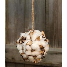 a ball of cotton hanging from a rope