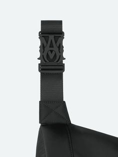 Accented with the season's embroidered AMIRI staggered logo, this utilitarian bag updates a classic silhouette through refinements in form and material. Adjustable straps with custom AMIRI hardware make this bag suitable for multiple stylings, from crossbody to belt bag wear. Pre-Spring 2024 Collection 100% NYLON DRY CLEAN ONLY Designer Black Belt Bag With Removable Belt, Designer Black Belt Bag With Belt Loops, Designer Black Crossbody Belt Bag, Designer Crossbody Belt Bag With Adjustable Strap, Business Black Shoulder Bag With Logo Strap, Designer Belt Bag With Adjustable Strap For Travel, Black Business Bag With Removable Belt, Designer Black Shoulder Belt Bag, Black Belt Bag With Adjustable Strap For Business