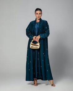 (Pre-orders only. Estimated delivery between: 10/02/25 - 14/02/25. If you require a quicker delivery, please contact us). The timeless 'Jasmine' abaya will have you feeling like royalty. Made from the most luxurious fabric in the Middle East - Japanese Crepe. This structured abaya is adorned with yellow gems and light blue beading. - Scarf included. Slip dress sold separately.  - Dry clean only. - Cool iron. - Colours may vary. - Model is 5'6 wearing size 54. Hijab Stile, Hijab Wedding Dress, Yellow Gems, Hijab Bride, Arab Fashion, Japanese Cotton, Modest Wedding Dresses, Hijab Dress, Islamic Fashion