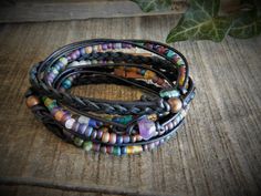 "This Wrap Bracelet for Women is so fun!, boho wrap brackets are so versatile, a bracelet you can wear every day. Amethyst Layering Bracelets are a great the summer look. ... Natural (will get darker with time) Napa leather braided, multi cord bracelet. A unique combination of High-fired stoneware, recycled glass, fresh water pearl and semi-precious stone beads combine to make this 3x wrap bracelet. It is adorned with a magnetic clasp that makes it very easy to put on by yourself. (4) SizesExtra Adjustable Hand Wrapped Bracelet For Festivals, Adjustable Hand Wrapped Wrap Bracelet For Festival, Festival Adjustable Hand Wrapped Bracelet, Unique Adjustable Wrap Bracelet For Festivals, Adjustable Wrap Bracelet For Festival, Bohemian Adjustable Hand Wrapped Bracelet, Bohemian Hand Wrapped Adjustable Wrap Bracelet, Bohemian Adjustable Braided Bracelets, Hand Wrapped, Bohemian Adjustable Wrap Bracelet For Healing