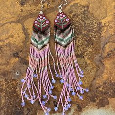 Boho Chic Long Beaded Earrings with Pink Glass Opal Bead Accents Make a statement with these handcrafted bohemian earrings, designed to bring a pop of color and elegance to your style. Perfect for festivals, casual outings, or a special occasion, these chic statement earrings are lightweight and vibrant, making them an effortless accessory for day or night. Key Features: Handwoven with Pink Glass Opal Bead Accents Includes high-quality Japanese Miyuki Delica seed beads, Czech seed beads, and Toh Festive Bohemian Pink Beaded Earrings, Bohemian Multicolor Beaded Fringe Chandelier Earrings, Bohemian Pink Beaded Earrings, Bohemian Pink Beaded Earrings With Fringe, Multicolor Fringe Dangle Earrings, Bohemian Chic Fashion, Native American Beaded Earrings, Beads Earrings, Native American Beading