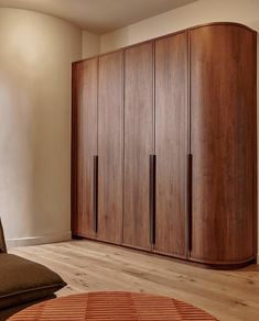 a large wooden cabinet in the corner of a room