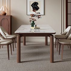 a dining room table with chairs around it