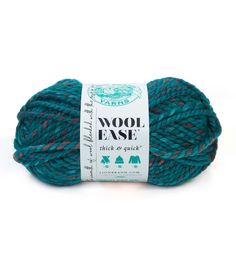 wool ease thick & quick yarn ball in teal, blue and red colors on a white background