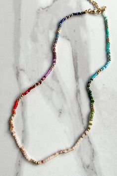 Update your jewelry collection with our Luisa Necklace! This dainty choker features a variety of colors and a cute seed bead design. With a lobster claw closure and 3" extension, it's easy to adjust to your desired length. Plus, the 14" chain adds a touch of elegance. Please note that actual colors and patterns may vary slightly. Dainty Choker, Curvy Shorts, Lobster Claws, Keychain Gift, Outdoor Wear, Bead Designs, Accessories Necklace, Seed Bead, Lobster Claw