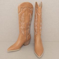 Designed meticulously with intricate cutouts and two-toned embroidery, the Ainsley cowboy boots are in a category of their own. Shaft Height: 14.5" Heel Height: 2.5"Circumference of shoe opening: 15"Shaft circumference: 13" Western Embroidered Boots For Rodeo, Western Style Embroidered Boots, Brown Embroidered Western Boots, Embroidered Snip Toe Boots For Rodeo, Fall Rodeo Embroidered Boots, Embroidered Brown Boots With Pointed Toe, Brown Embroidered Boots With Pointed Toe, Brown Embroidered Pointed Toe Boots, Cowboy Boot