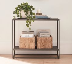 a shelf with books and baskets on it