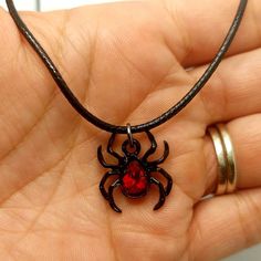 Black spider 🕷 charm on 18 inch faux leather cord. Halloween Black Jewelry With Charms, Black Halloween Jewelry With Charms, Adjustable Black Themed Necklace, Black Novelty Jewelry With Charms, Novelty Black Jewelry With Charms, Themed Black Jewelry As Gift, Themed Black Jewelry Gift, Adjustable Necklace For Halloween Gift, Black Novelty Jewelry For Gifts