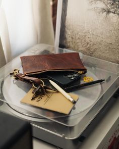 The zip pouch is handmade of beautiful full-grain leather, with a solid brass zipper that features a big and beautiful "donut" pull. It's the perfect accessory to organize items in your tote or to carry on its own. The small zip pouch measures 5.5 inches by 7.5 inches, and the medium zip pouch measures 7 inches by 9.5 inches. Navy Clutch, Leather Zip Pouch, Zipper Pouches, Carryall Tote, Leather Clutch Bag, Office Bag, Mini Tote Bag, Envelope Clutch, Leather Clutch Bags