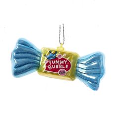 a blue gummy bubble candy ornament hanging from a chain on a white background