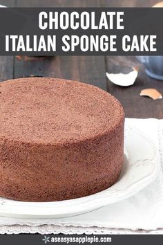 a chocolate italian sponge cake on a white plate with the title overlay reads, chocolate italian sponge cake