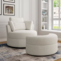 a white chair and ottoman in a living room