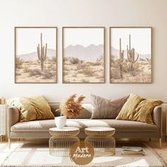 a living room filled with furniture and paintings on the wall above it's couch