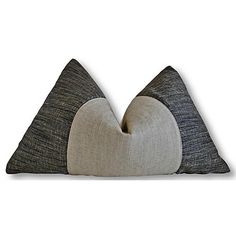 two black and white pillows sitting on top of each other