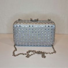 Womens silver crystal evening clutch bag with silver, crystal embellished top closing clasp Can be used with or without long shoulder chain (included) size approx- H 11cm x W 18cm Free Royal Mail delivery is an estimated 3-5 days but this can occasionally be slightly longer which solely on the Royal Mail side. We do offer guaranteed next day delivery but please contact us prior to ordering as this would incur a small upgraded shipping charge. We also offer WORLDWIDE shipping - please contact us Mail Delivery, Quality Handbags, Shoulder Chain, Embellished Top, Silver Crystal, Evening Clutch Bag, Gorgeous Bags, Portable Travel, Evening Clutch