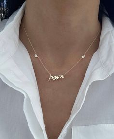 This necklace features the word/name of your choice with bezel set diamond accents in the chain. Available in: 14K Yellow, White or Rose Gold Length is based on how many letters Script Height is approx. 5mm - 7mm - varies per letter and uppercase/lowercase Block Height - 5mm Up to 10 letters only Choose from Block or Script Font Choose from one or two stones FINAL SALE Minimalist Diamond Name Necklace For Anniversary, Sterling Silver Name Necklace With Diamond Accents, Minimalist Personalized Diamond Name Necklace, Sterling Silver Custom Name Necklace, Custom Name Sterling Silver Necklace Fine Jewelry, Custom Name Sterling Silver Necklace, Necklace With Diamond, Bezel Set Diamond, Christmas Jewelry