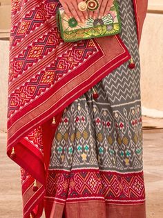 Wear this stunning grey & red silk saree with digital print work and elevate your style quotient to new heights. Crafted with utmost precision, this saree showcases a perfect blend of traditional charm and contemporary appeal. The exquisite digital print work on the saree adds a touch of elegance and sophistication to its overall design.
This beautiful saree is made from high-quality silk material that exudes a luxurious sheen. The grey and red color combination lends a captivating allure to Red Saree With Printed Motifs In Traditional Drape, Red Bollywood Dupatta With Digital Print, Festive Red Dupatta With Digital Print, Red Digital Print Dupatta For Navratri, Festive Red Digital Print Dupatta, Red Semi-stitched Saree With Printed Motifs, Traditional Red Digital Prints With Motifs, Red Silk Saree, Red Silk Blouse