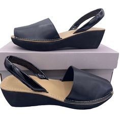 New In Box Size 8.5 Women's Slip-On Wedge Sandal Open-Toe Silhouette Roomy Toe Base Faux Leather Strap At Back 2" Platform 100% Man Made Material Wipe Clean Pet And Smoke Free Home **69 Black Cushioned Slingback Sandals, Casual Black Open Toe Slingback Pumps, Black Synthetic Closed Toe Slingback Sandals, Black Wedge Heel Slingback Sandals, Black Platform Wedge Slingback Sandals, Black Slingback Platform Wedge Sandals, Black Slingback Heels With Cushioned Footbed, Synthetic Slingback Wedge Sandals Medium Width, Black Platform Slingback Sandals