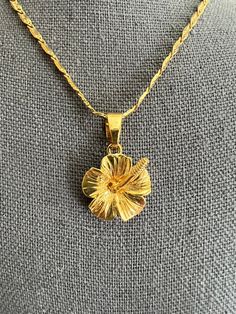 You don't have to travel all the way to Hawaii to love Plumeria Just grab this gorgeous delicate 24 K gold plated Plumeria flower pendant with Singapore chain! So beautifully made! Pendant without bail is about 3/4 of an inch.Please watch my video and check out matching earrings with clear or light lilac crystals! 18 inch long. Hawaiian Plumeria, Delicate Pendant, Jewelry Fashion Trends, Classy Jewelry, Charm Necklaces, Jewelry Essentials, Funky Jewelry