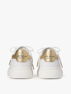 we call these our lift sneakers for a reason: the platform midsoles will add a little bit of height plus the supple nappa leather with pops of print and color will instantly elevate any outfit you pair them with. | Kate Spade Lift Sneakers, Optic White/Pale Gold - 11 Calf Leather Lace-up Shoes With Textured Sole, Leather Lace-up Shoes With White Sole, Elegant Lace-up Sneakers With White Sole, Designer Leather Sneakers With Laces, Gold Leather Sneakers With Laces, Designer Leather Sneakers, Lace-up Calf Leather Sneakers, Luxury Low-top Lace-up Shoes In Calf Leather, Luxury Low-top Lace-up Calf Leather Shoes