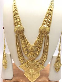 Handmade Indian Jewelry Asian Wedding Bridal Jewellery Party Ethnic Wear 22ct Gold Plated Bridal Necklace Set Rani Haar Bridal Jewellery Set  PLEASE NOTE, This Item Is Not Real Gold .Only Good Quality Gold Plated Jewellery .it is Artificial Jewellery.  It is a perfect match with formal attire on special occasions or with casual wearing.  Slight Colour variations possible due to difference in screen and photograph Care instructions Keep Jewellery away from direct heat, water, perfumes, deodorants Gold Meenakari Bridal Necklace In 22k Gold, Gold Temple Jewelry Tikka For Eid, Heavy Bollywood Jewelry Sets In Yellow Gold, Heavy Bollywood Yellow Gold Jewelry Sets, Gold Wedding Sets For Diwali, Heavy Gold Jewelry Sets For Festive Season, Bollywood Gold Sets With Intricate Design, Gold Meenakari Tikka For Ceremonial Occasions, Heavy 22k Gold Jewelry Sets For Festivals