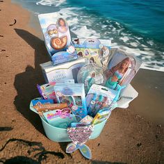 there is a bucket full of items on the beach