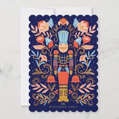 a card with an image of a nutcracker and flowers on the front, in blue