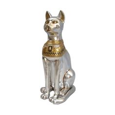 a silver and gold cat figurine on a white background