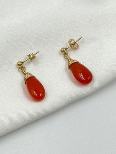 Discover the enchanting beauty and healing properties of our Carnelian gemstone earrings, perfect for those born in July. The deep orange hue of Carnelian not only complements the July birthstone but also brings warmth and energy into your life. Carnelian is believed to enhance physical energy and stamina, boost self-confidence, stimulate creativity, improve emotional balance, and support physical healing, especially for the reproductive organs, kidneys, and bladder. These earrings are not just Born In July, Carnelian Earrings, Physical Healing, Orange Earrings, July Birthstone Jewelry, Deep Orange, Emotional Balance, July Birthstone, Gemstone Healing