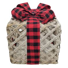 a red and black plaid christmas present wrapped in lace