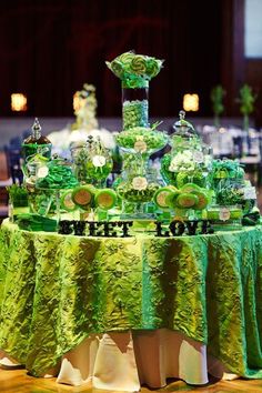 the table is covered with green and white decorations