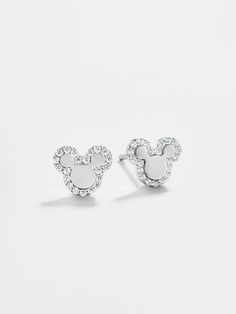 The perfect dainty Disney pairing, the Disney Sterling Silver studs feature a silver metal Mickey Mouse outline with a gorgeous pavé border. Mouse Outline, Mickey Mouse Outline, Disney Character Makeup, Mickey Mouse Silhouette, Mouse Earrings, Disney 2024, Disney Bracelet, Mickey Mouse Earrings, Disney Jewelry