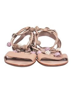 Elevate your boho look this summer with these sandals from Loeffler Randall! These strappy sandals feature adorable baubles and are perfect for any casual outing or even a music festival! Pair with a sundress and hobo bag for a hippie chic look. Size 7 Leather upper w/ strappy design Pink, green, tan and white baubles on straps Slip on closure w/ ties Leather sole and footbed w/ minor wear on toes Original dustbag included Length 9.5" Bohemian Flat-heeled Party Sandals, Beige T-strap Sandals For Summer Vacation, Casual Open Heel Lace-up Sandals For Vacation, Spring Vacation Toe Ring Sandals With Adjustable Strap, Spring Beach Beige T-strap Sandals, Casual Beach Toe Ring Sandals With Adjustable Strap, Summer Lace-up Sandals With Open Heel For Vacation, Casual Toe Ring Sandals With Adjustable Strap For Beach, Beige T-strap Sandals For Spring Beach Occasion