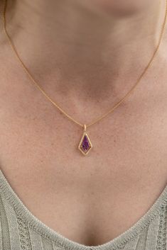 Unique amethyst pendant with a drop style kite shape. The center gemstone is suspended in a floating halo, so movement and light can make this amethyst dance! 14k Yellow Gold, 18" Chain with lobster clasp .17tw VS Natural Diamonds 1.00ct Natural Amethyst Infinite Jewelry, Gold Pendant Designs, Simple Elegant Necklace, Amethyst Jewellery, Gold Chain With Pendant, Amethyst Jewelry, Jewelry Lookbook, Amethyst Necklace, Amethyst Pendant