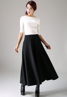 "Look elegant and stylish at all times and for any occasion in this long black classical A-line skirt. This flared women skirt with double stitching detail at hip pockets oozes understated sophistication. This very versatile winter skirt can be worn casually with knitwear or more formally with a crisp white blouse.This is a timeless investment piece you'll have in your wardrobe for years to come. Choosing black makes it so easy to pair with a variety of blouses and jackets. Scientific studies ha Long Work Skirt, Vintage Skirt Outfit, Winter Wool Skirt, Full Skirt Outfit, A Line Skirt Outfits, Long Wool Skirt, Maxi Skirt Winter, Black Wool Skirt, 90s Fashion Outfits Hip Hop Party