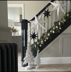 a staircase decorated with christmas decorations and stars