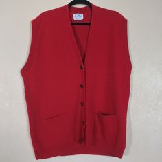 Vintage Sweetree Red Cardigan Sweater Vest Women's Large Pit to pit 23" Length 27" 100% Acrylic This colorful vintage Sweetree sweater vest is the perfect addition to your holiday wardrobe. The red acrylic material gives it a classic 90s vibe, while the V-neckline and sleeveless design provide a modern twist. This cardigan style sweater is a size large and will fit comfortably on any woman. The Christmas theme of this sweater makes it the perfect choice for your holiday parties or family gatherings. The overall design is both festive and stylish, featuring a colorful knit pattern that will make you stand out in any crowd. Don't miss your chance to add this unique and eye-catching piece to your collection. Red V-neck Sweater Vest For Winter, Classic Red Vest For Fall, Classic Red Sleeveless Outerwear, Classic Red Winter Vest, Casual Red Sweater Vest For Winter, Vintage Red Sweater Vest For Fall, Red Vintage Sweater Vest For Fall, Fitted Red Sweater Vest For Winter, Vintage V-neck Sweater Vest For Winter