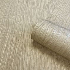 a close up view of the textured fabric on an unmade bedspread