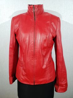 Sporty red leather women's jacket. Stylish women's red leather jacket with a metal zipper. The jacket is made of durable soft red genuine leather. The jacket fastens with a metal zipper. The jacket has two convenient pockets at the bottom. The jacket has a stand-up collar. The cuffs of the jacket can be rolled up to add decoration and reduce the length of the sleeves. The jacket has a nice polyester lining. The jacket is comfortable, reliable and pleasant to wear, it will protect you from wind, Red Leather Biker Jacket With Zipper Closure, Fitted Red Leather Jacket, Soft Red, A Metal, Leather Jackets Women, Metal Zipper, Stylish Women, Lady In Red, Red Leather Jacket