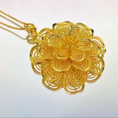 -Material: 18k Gold Filled -Medallion Size: 44.5 X 43.5mm -Box Chain Thickness: 1.2mm -Perfect For All Time. -High-Quality Necklace! Exquisite Gold Flower Shaped Necklace, Exquisite Gold Necklace With Large Pendant, Rose Gold Necklaces With Intricate Design For Gift, Gold Flower Shaped Necklace For Formal Occasions, Gold Flower Jewelry With Intricate Design, Rose Gold Necklace With Intricate Design For Gift, Elegant Flower Filigree Necklace, Elegant Yellow Gold Jewelry With Rose Design, Gold Rose Design Pendant Jewelry