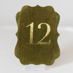 a close up of a waxed stamp with the number twelve on it