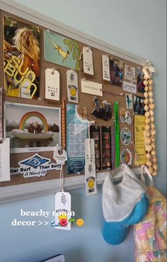 a bulletin board is hanging on the wall with magnets and other items attached to it