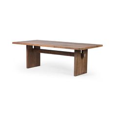 a wooden table sitting on top of a white floor