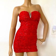 Very Pretty Red Sequin Lace Stretch Strapless Party Dress With Beautiful V Shaped Crystal Ornament At Bust; Size Xxs Measures 24 Inch Bust, 22 Inch Waist, 28 Inch Hips; Unstretched Measurements. The Length Is 26 Inches; Has Side Zipper; New Without Tags. Red Stretch Mini Dress For Party, Red Strapless Dress For Cocktail Party Season, Red Strapless Dress For Night Out, Red Stretch Strapless Dress For Night Out, Stretch Strapless Dress With Sweetheart Neckline For Party, Strapless Stretch Dress With Sweetheart Neckline For Party, Red Strapless Dress For Party Season, Glamorous Red Strapless Dress For Night Out, Stretch Mini Dress With Sweetheart Neckline For Party